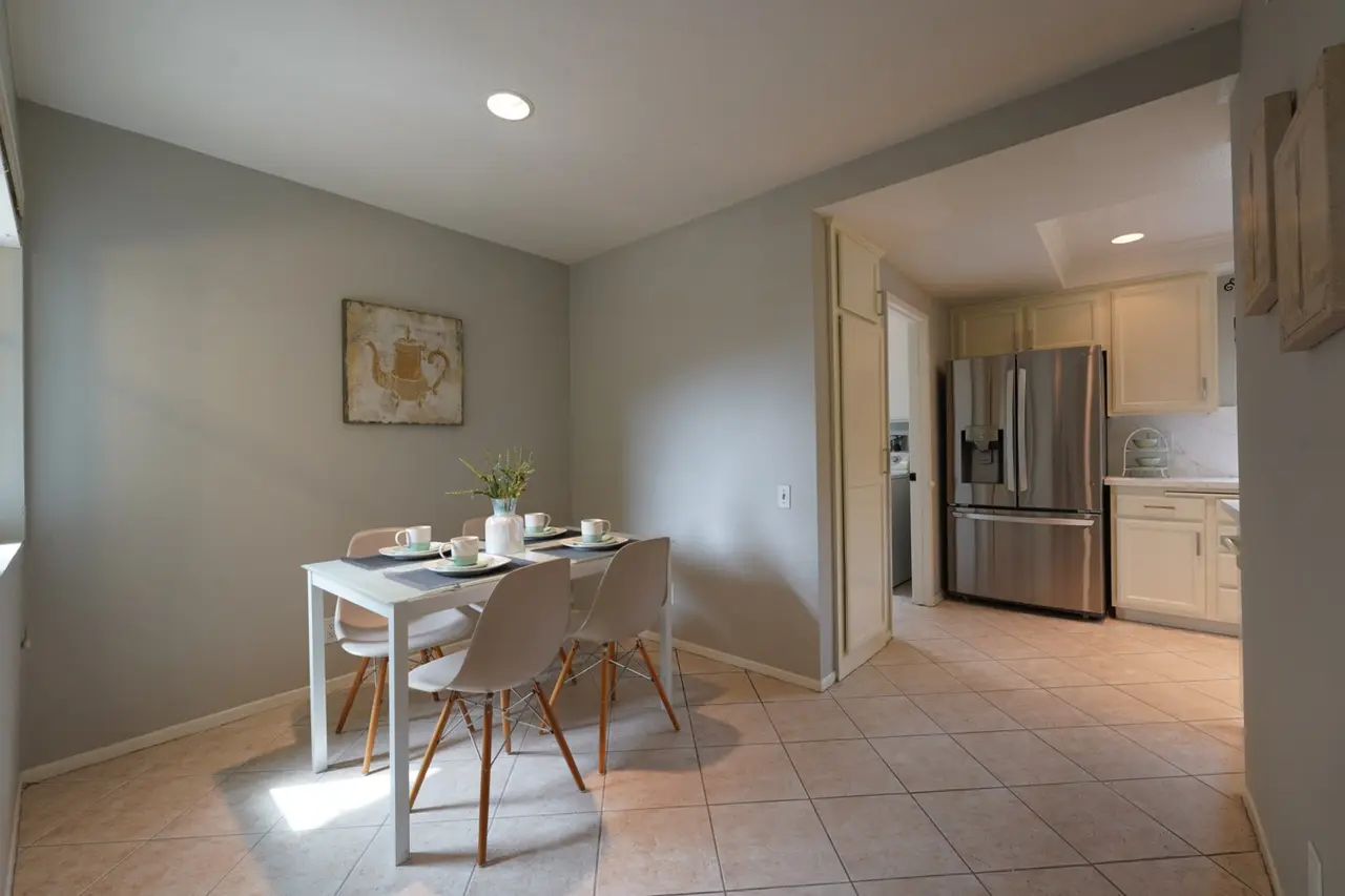 Second dining room with tile floors next to the kitchen
